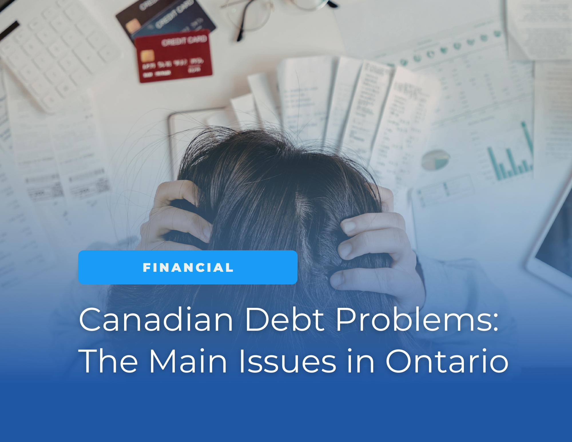 Person sitting with hands on their head surrounded by bills, receipts, credit cards, and financial documents, representing financial stress and debt problems in Ontario.