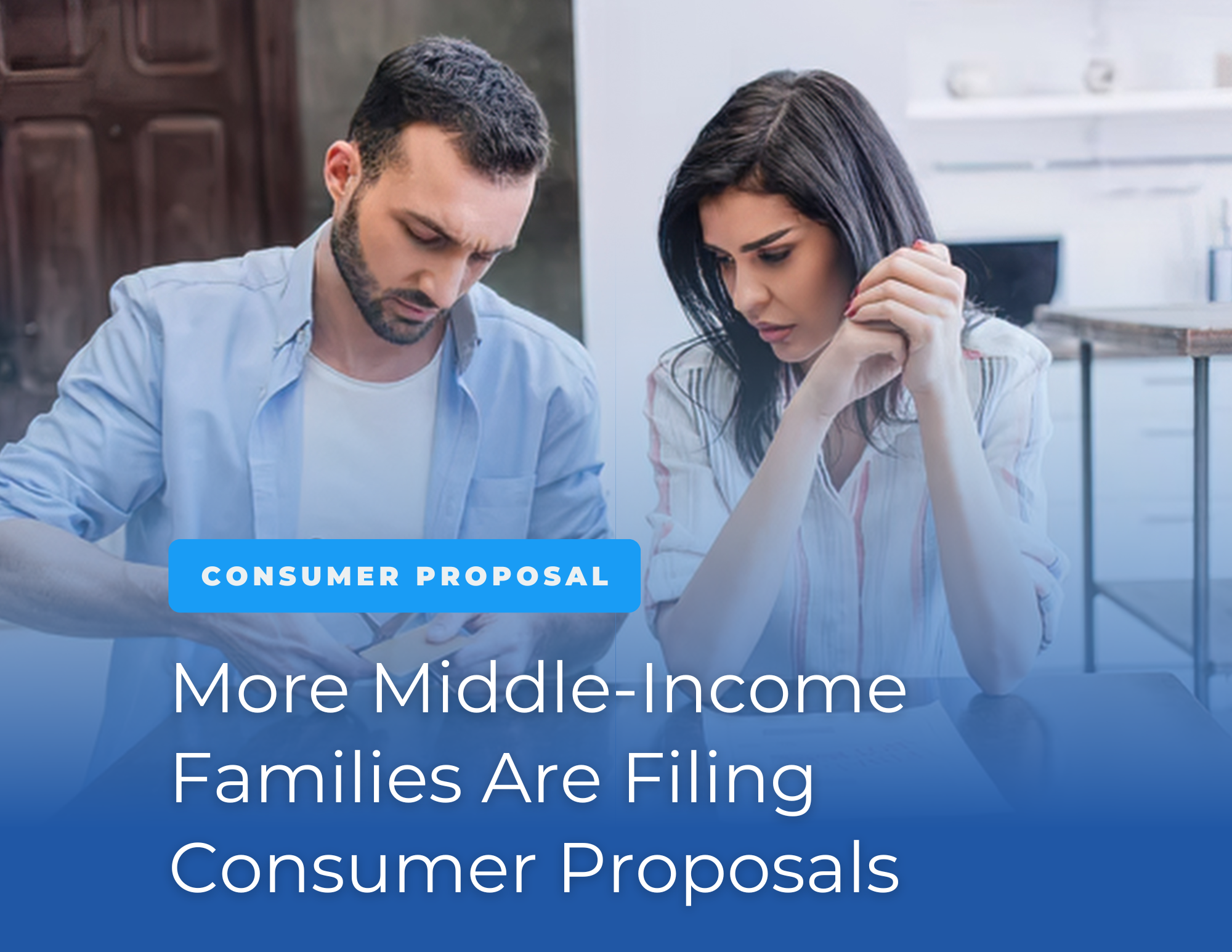a middle-class /middle-income couple sitting together reviewing finances.